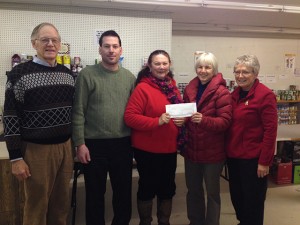 Christine Lauffer of the Burk's Falls Food Bank receives a cheque from Louisa Moffit, Director of The Lakelands Board. Also in attendance, Realtors® Jim Creasor, Emilio Foffano, Judy Ransome