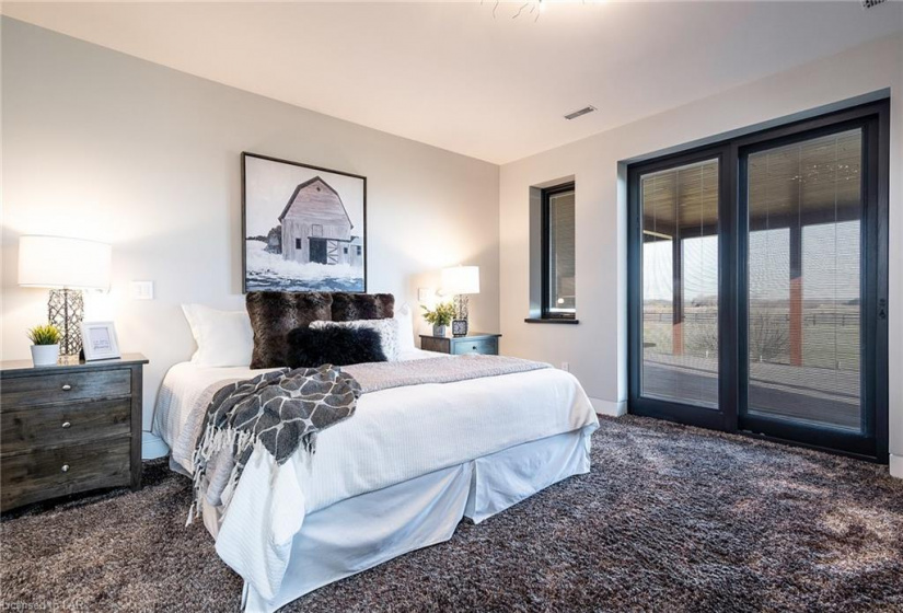 Lots of space for a king size bed and side tables with great views and access to the covered deck area.