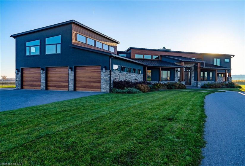 Exceptional custom home with over 4200 sf of living space.  Feel the warmth with all the wood elements  including incredible cathedral ceilings mixed with modern elements throughout the home.