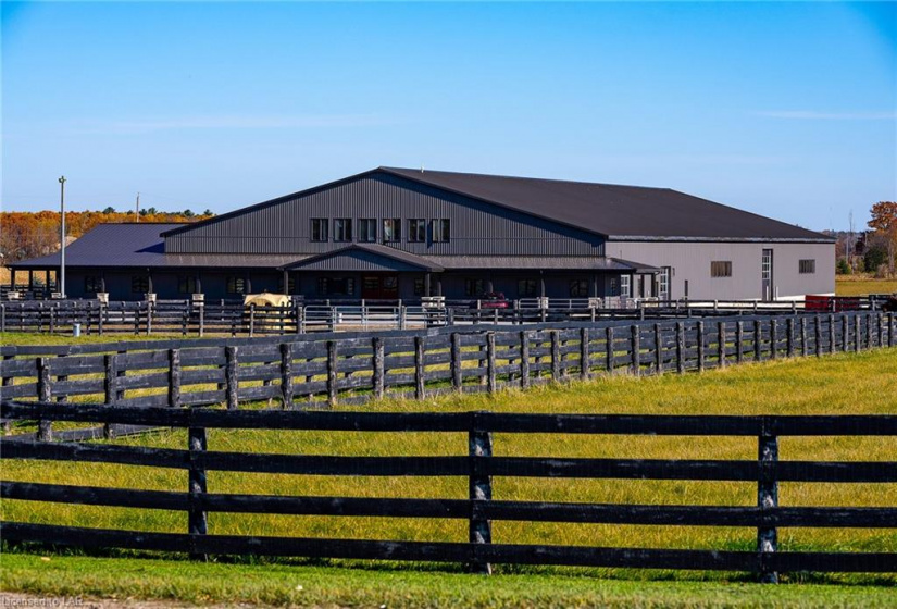 4 fully custom fenced paddocks throughout the property along with 42,000 sf outdoor riding arena.  3 sand paddocks and 4 grass paddocks. No detail has been left undone keeping your horses in mind.